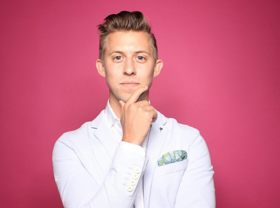 man in white suit jacket